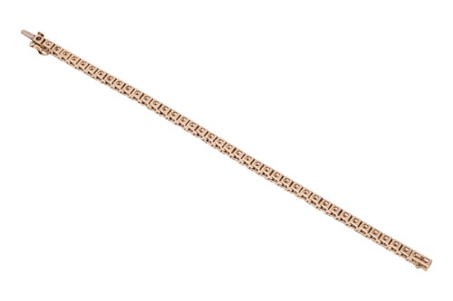 Lot 294 - A diamond tennis bracelet, featuring forty-two...