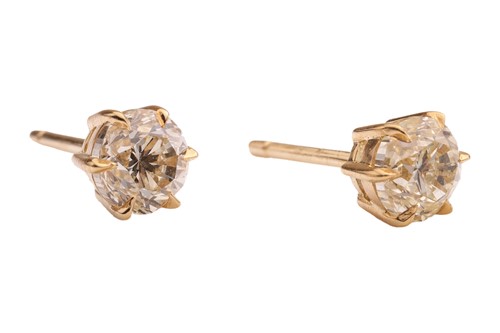 Lot 293 - A pair of diamond stud earrings, with a total...