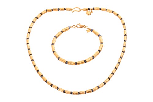 Lot 125 - A sapphire bead necklace and bracelet suite by...