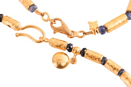Lot 125 - A sapphire bead necklace and bracelet suite by...