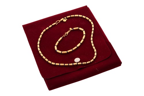 Lot 125 - A sapphire bead necklace and bracelet suite by...