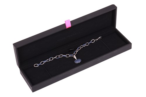 Lot 228 - Theo Fennell - An ‘Art’ charm bracelet in 18ct...