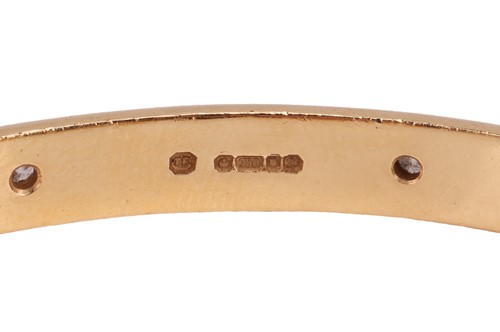 Lot 185 - Theo Fennell - A diamond-set closed bangle in...