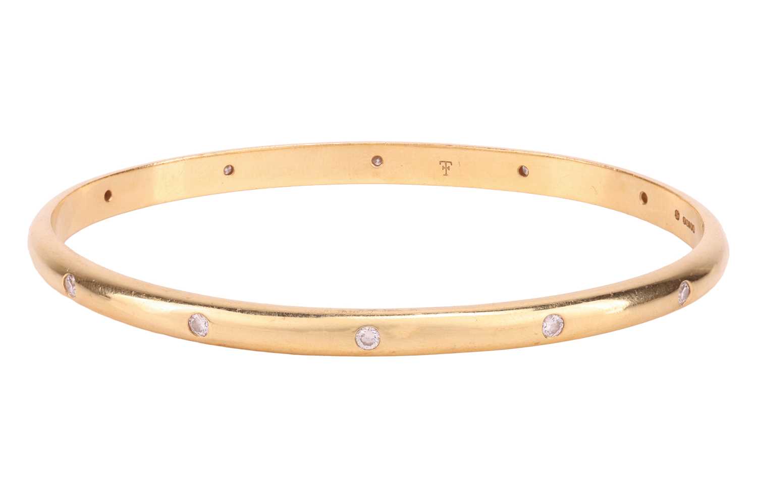 Lot 185 - Theo Fennell - A diamond-set closed bangle in...