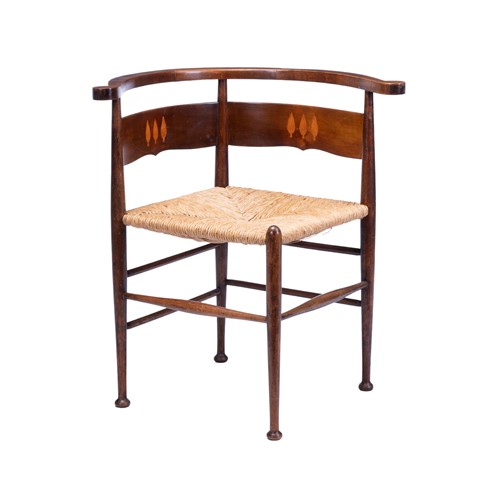 Lot 53 - An Arts and Crafts mahogany and inlaid corner...