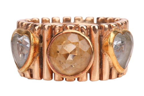 Lot 79 - A citrine and aquamarine dress ring, the wide...