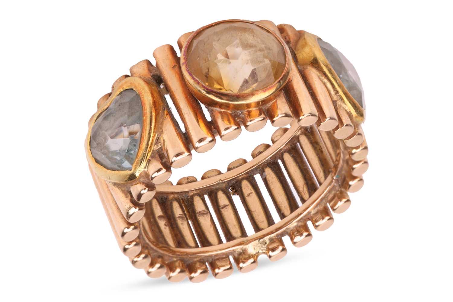 Lot 79 - A citrine and aquamarine dress ring, the wide...