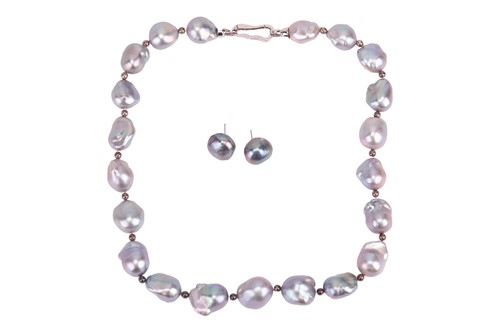 Lot 64 - A baroque pearl single-strand necklace and...