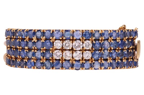 Lot 77 - A sapphire and diamond hinged bangle,...