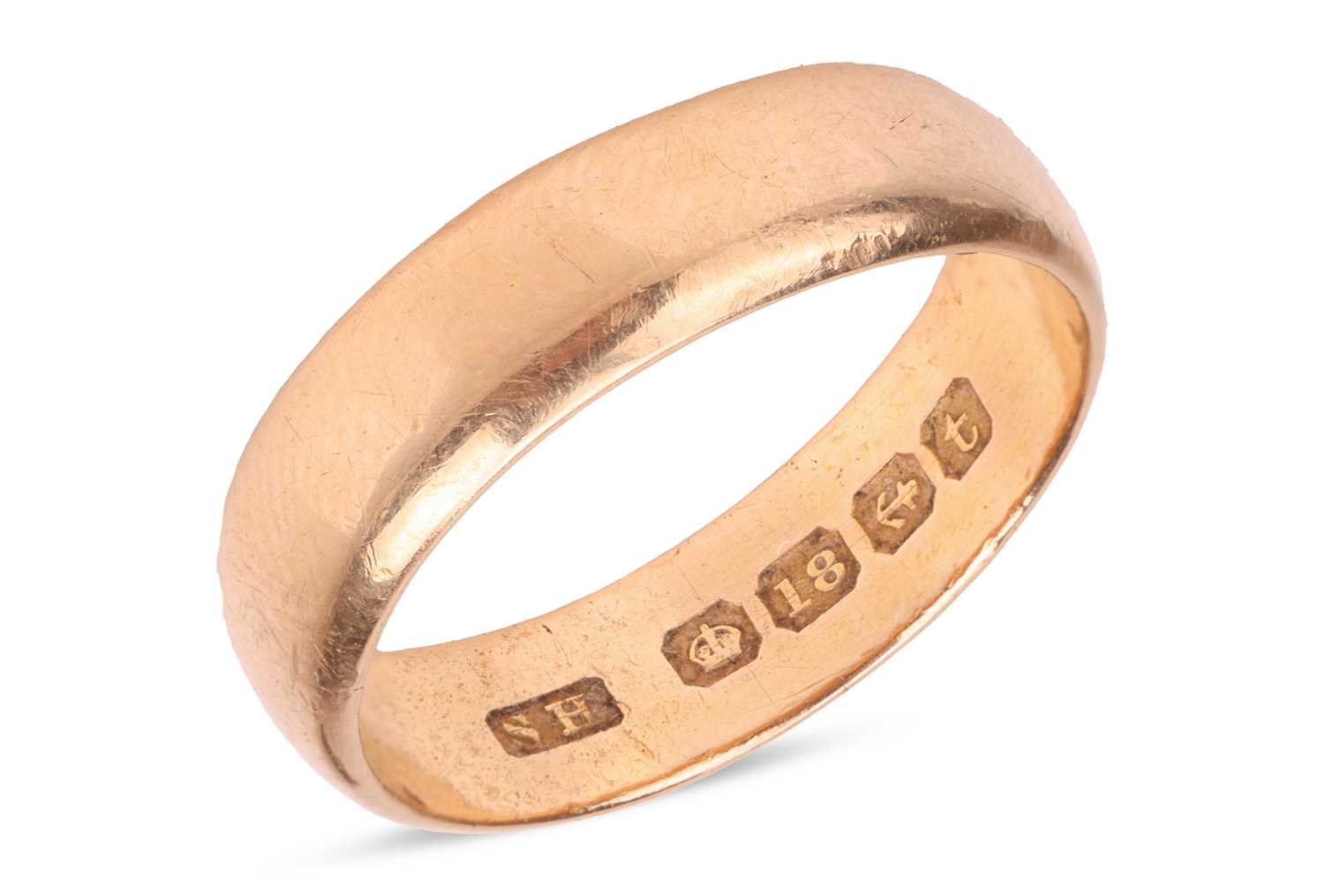 Lot 44 - A wide wedding band in 18ct yellow gold, the...