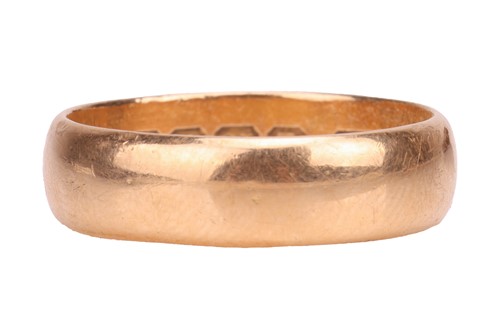 Lot 44 - A wide wedding band in 18ct yellow gold, the...