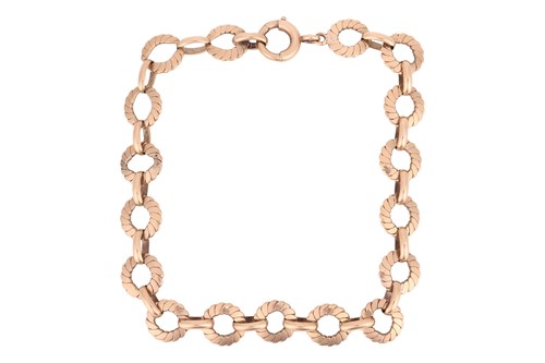 Lot 27 - A fancy link bracelet in 9ct yellow gold,...