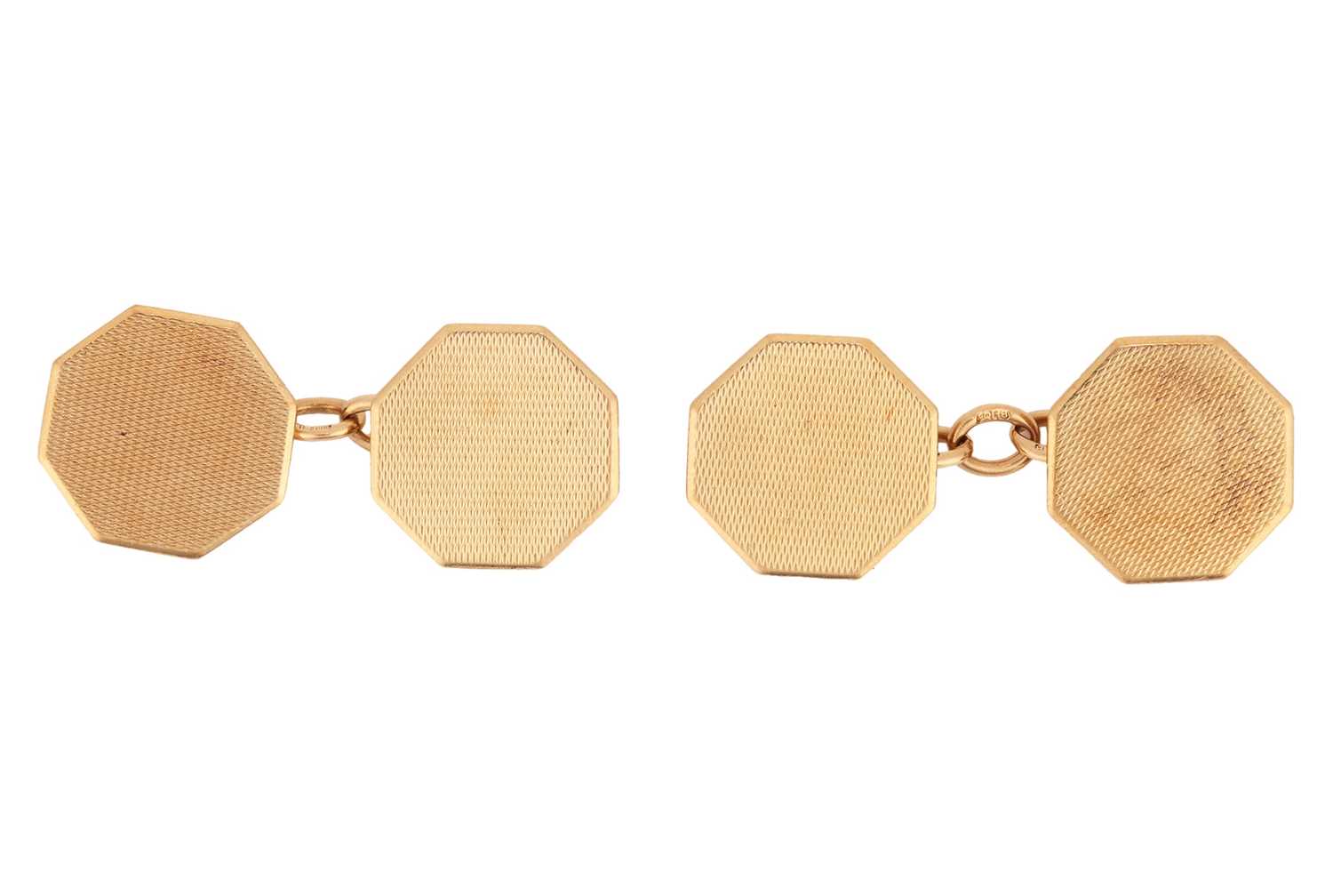 Lot 23 - A pair of hexagonal cufflinks in 9ct gold, the...