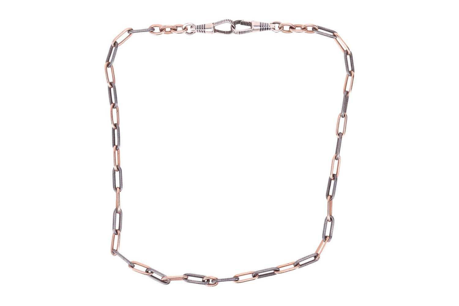 Lot 31 - A Continental Niello watch chain, terminated...
