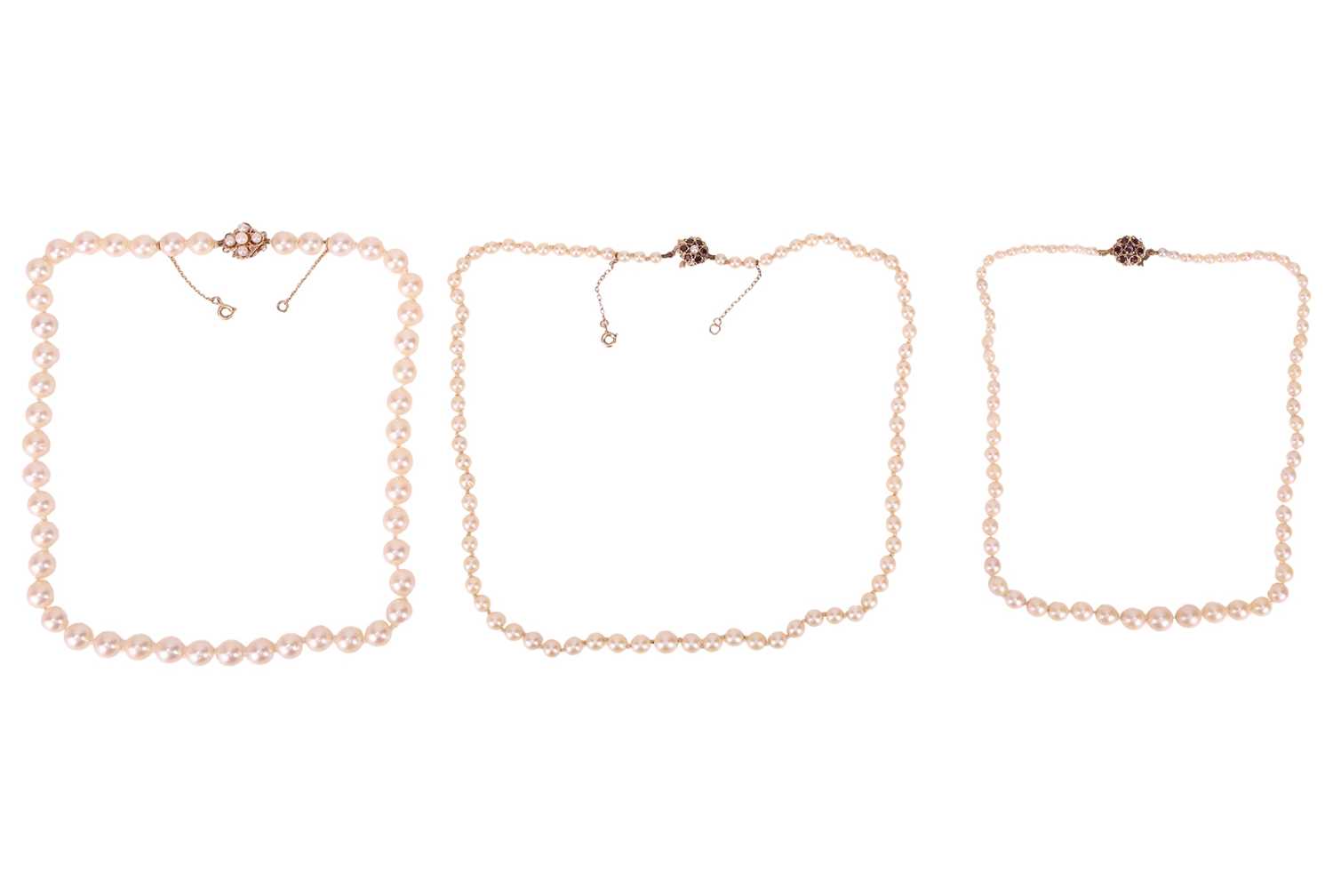 Lot 16 - Three cultured pearl necklaces, each with a...