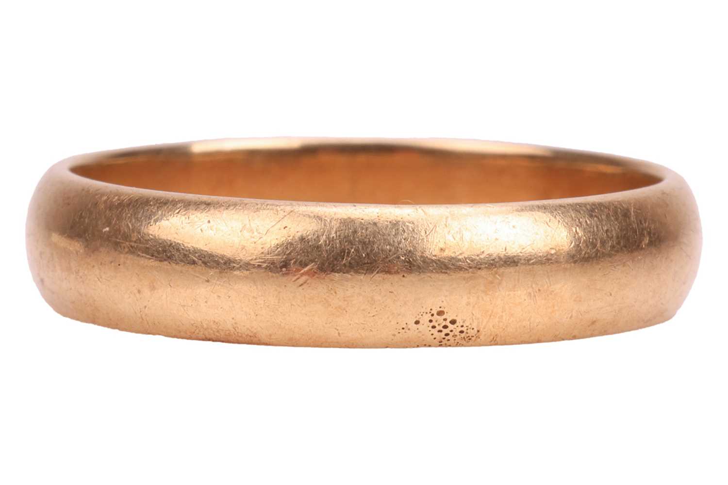 Lot 22 - A plain wedding band, consisting of a polished...