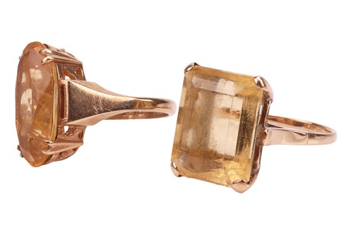 Lot 9 - Two citrine dress rings; to include a...