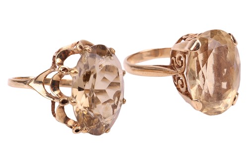 Lot 17 - Two 9ct gold citrine dress rings; the first...