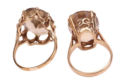 Lot 17 - Two 9ct gold citrine dress rings; the first...