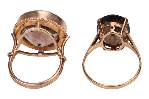 Lot 35 - Two smoky quartz rings; the first contains a...