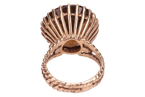 Lot 40 - A smoky quartz cocktail ring, contains a...
