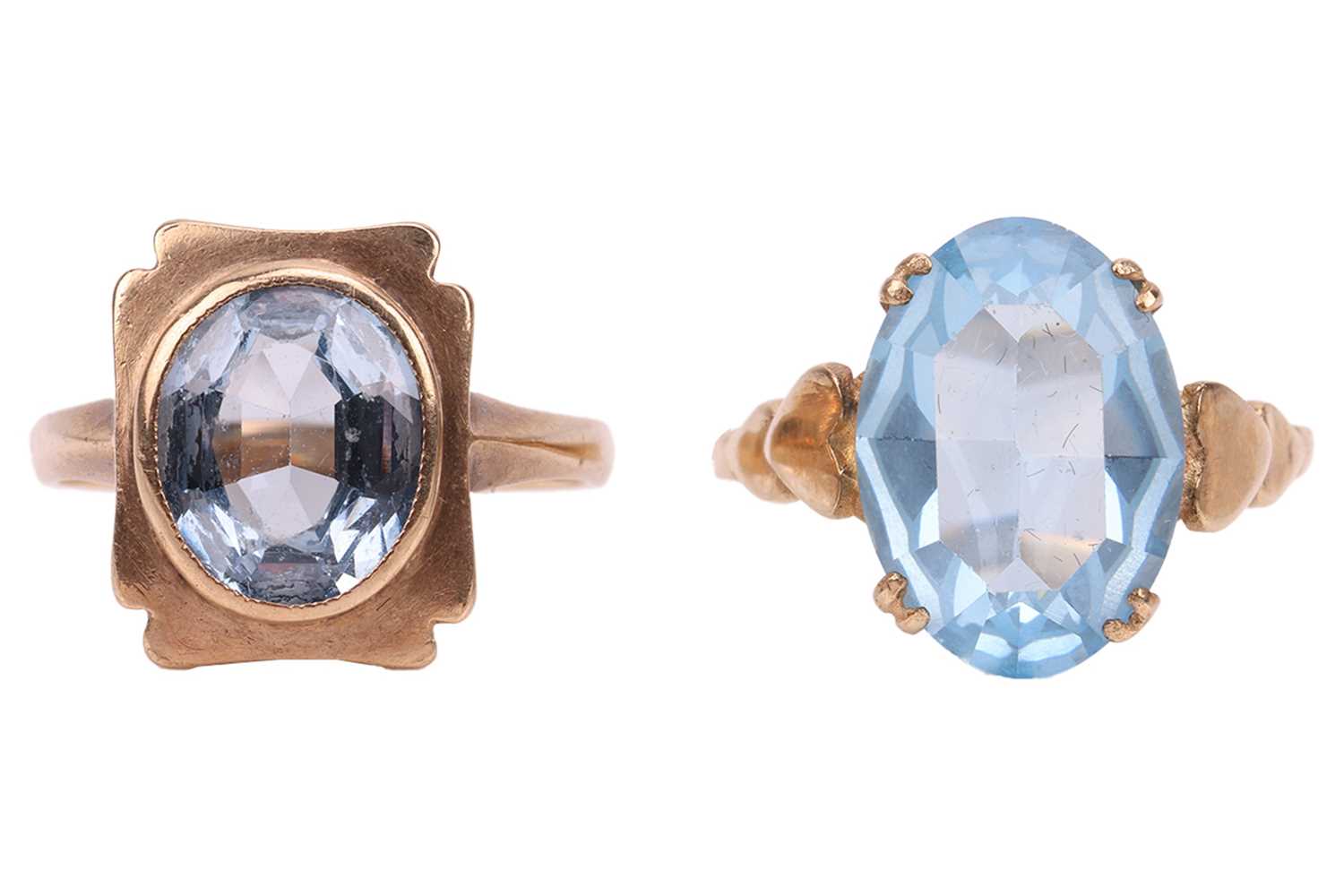 Lot 42 - Two 9ct gold synthetic spinel dress rings; the...
