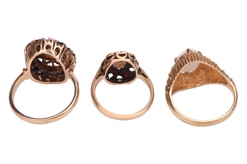 Lot 58 - Three opal dress rings; The first an opal and...
