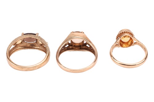Lot 63 - Three dress rings, comprising a smoky quartz...