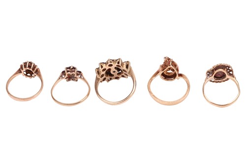 Lot 70 - A small group of garnet-set dress rings,...