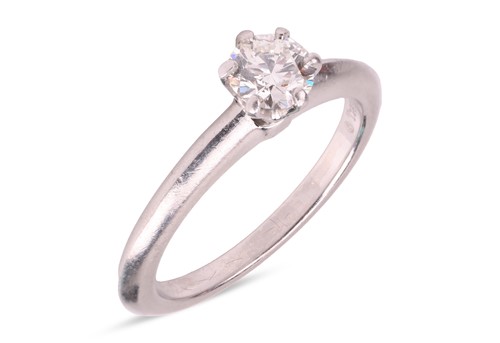 Lot 189 - Tiffany & Co. - A diamond solitaire ring, claw-...