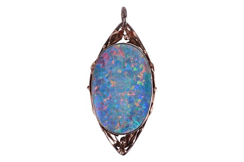 Lot 61 - An Arts and Crafts opal doublet pendant,...