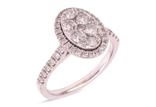 Lot 266 - A diamond-set cluster ring in 18ct white gold,...
