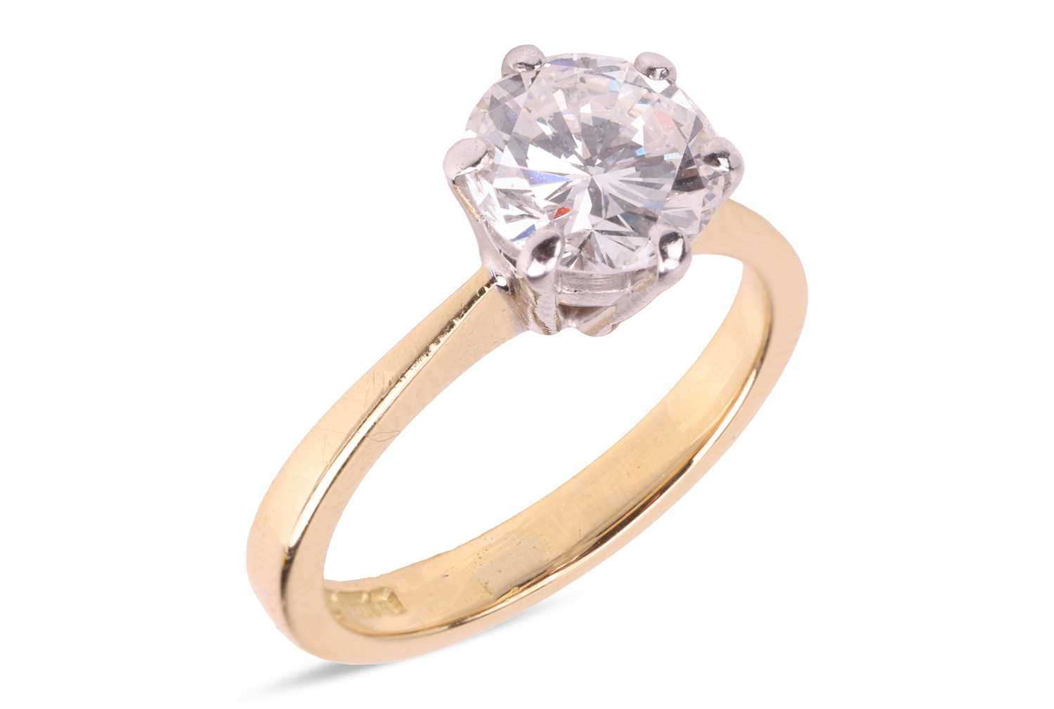 Lot 295 - A diamond solitaire ring in 18ct gold, the...