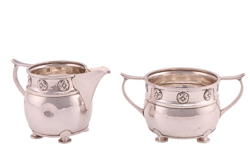 Lot 413 - An Arts and Crafts silver creamer and sugar...