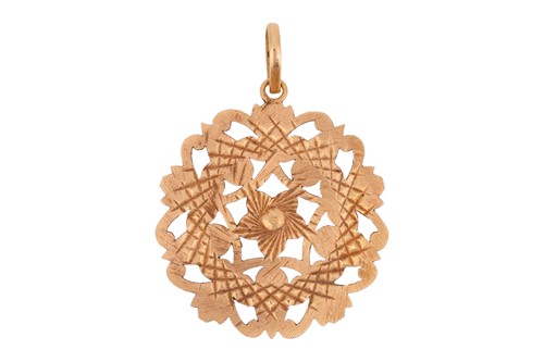 Lot 104 - A pierced medallion pendant, of floral design,...