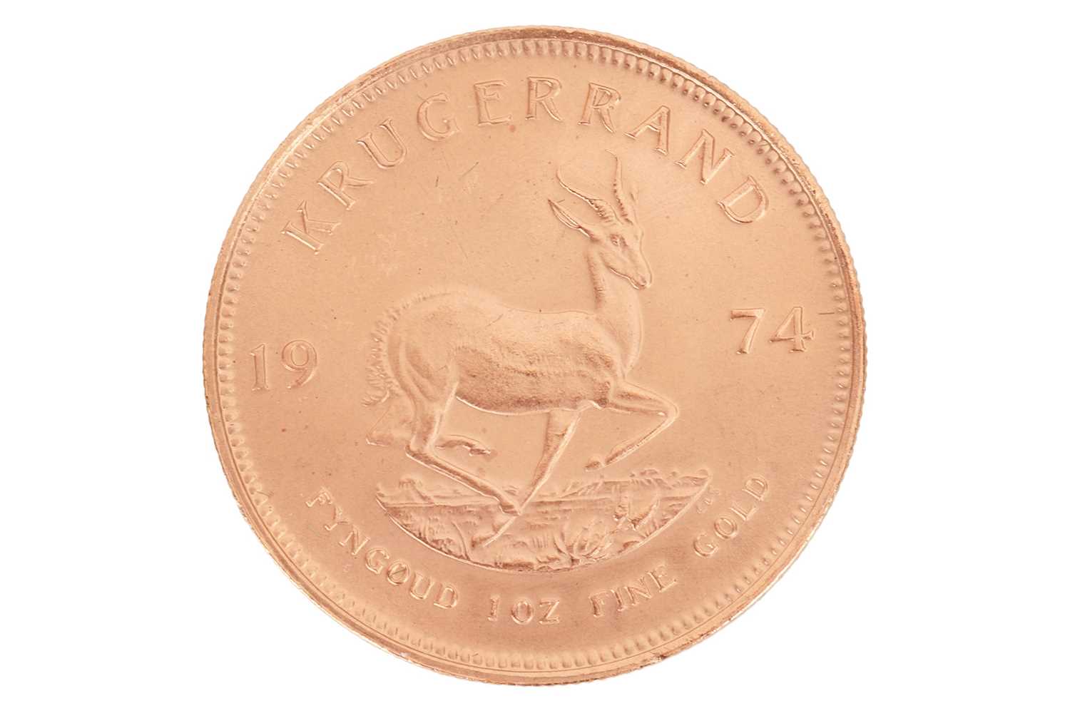 Lot 242 - A South African 1oz gold Krugerrand, dated 1974.