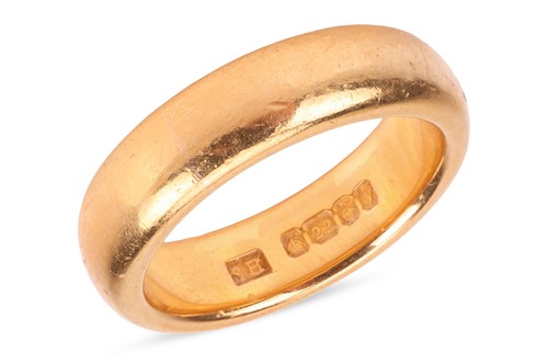 Lot 118 - A 22ct gold band ring, the polished band...
