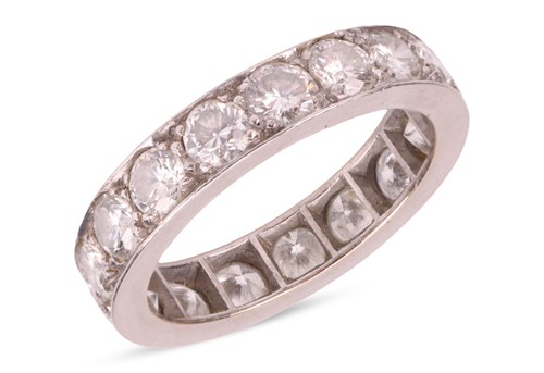 Lot 120 - A diamond eternity ring, claw-set with...