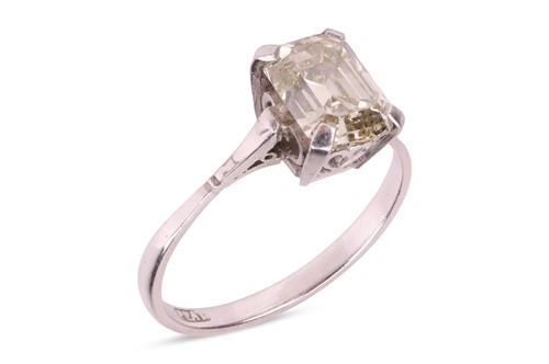 Lot 103 - A diamond single-stone ring, the four-claw set...