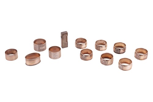 Lot 302 - A group of eleven assorted silver napkin rings,...