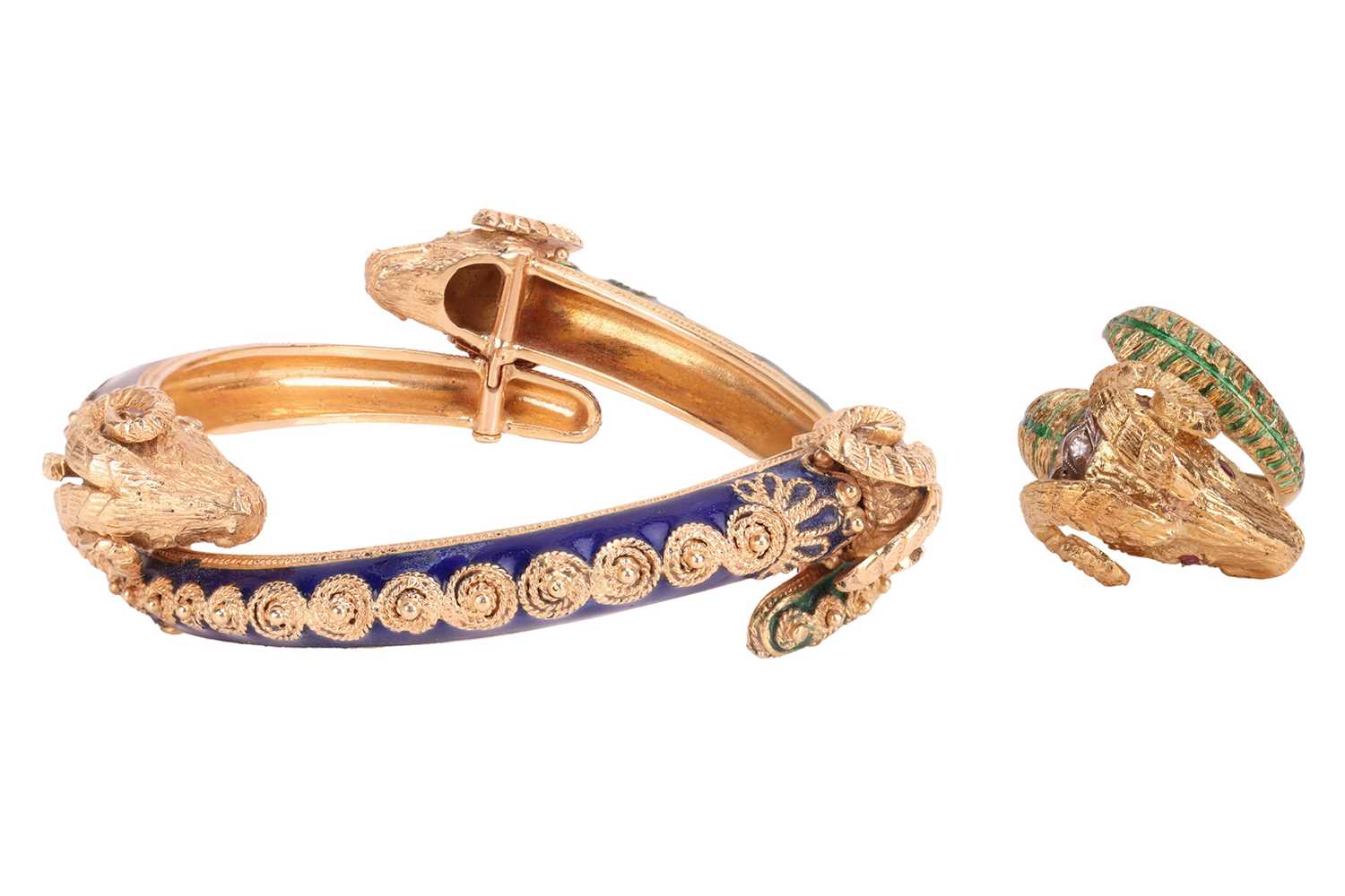 Lot 93 - A bangle and a ring of rams head motif design,...