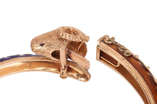 Lot 93 - A bangle and a ring of rams head motif design,...