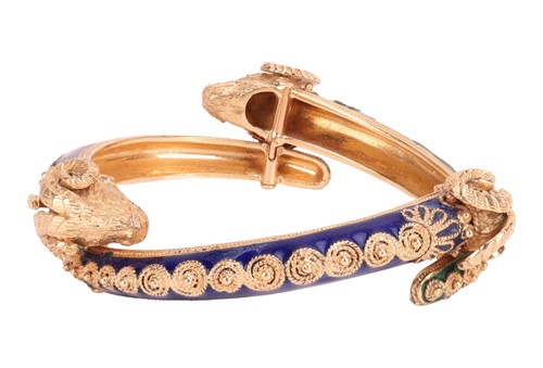 Lot 93 - A bangle and a ring of rams head motif design,...