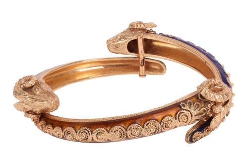 Lot 93 - A bangle and a ring of rams head motif design,...