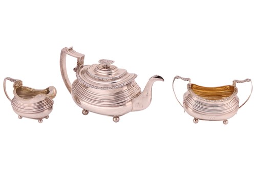 Lot 338 - A George III silver three-piece tea service,...