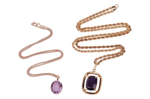 Lot 55 - Two amethyst pendants on chains; The first...