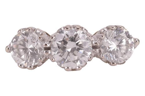 Lot 135 - A diamond three-stone ring, with an estimated...