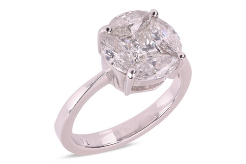 Lot 131 - A diamond cluster ring, illusion-set with a...