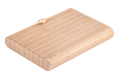 Lot 258 - A cigarette case in 14ct gold, of reeded...