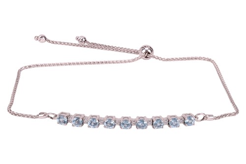Lot 117 - An aquamarine and diamond bracelet by Angara,...